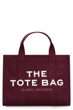 Load image into Gallery viewer, La traduzione di "The Canvas Medium Tote Bag" in italiano è "La borsa a tracolla in tela di media grandezza".