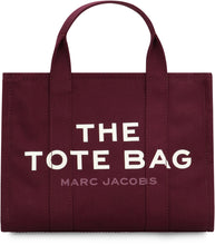 Load image into Gallery viewer, La traduzione di "The Canvas Medium Tote Bag" in italiano è "La borsa a tracolla in tela di media grandezza".