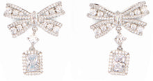Load image into Gallery viewer, Dangle earrings in the shape of a bow with crystals